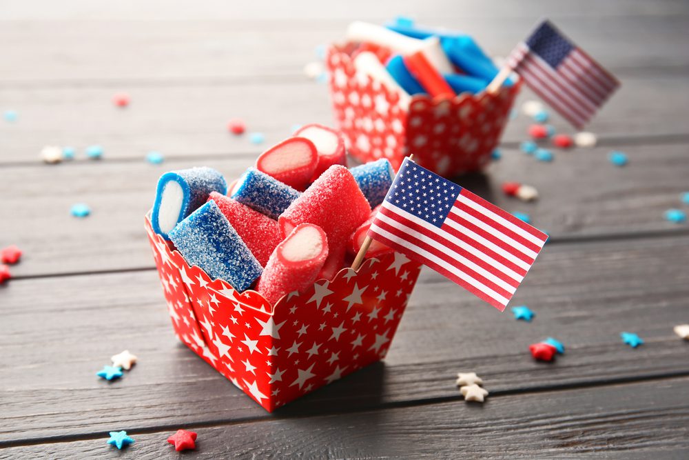 A table with two baskets of patriotic candy.