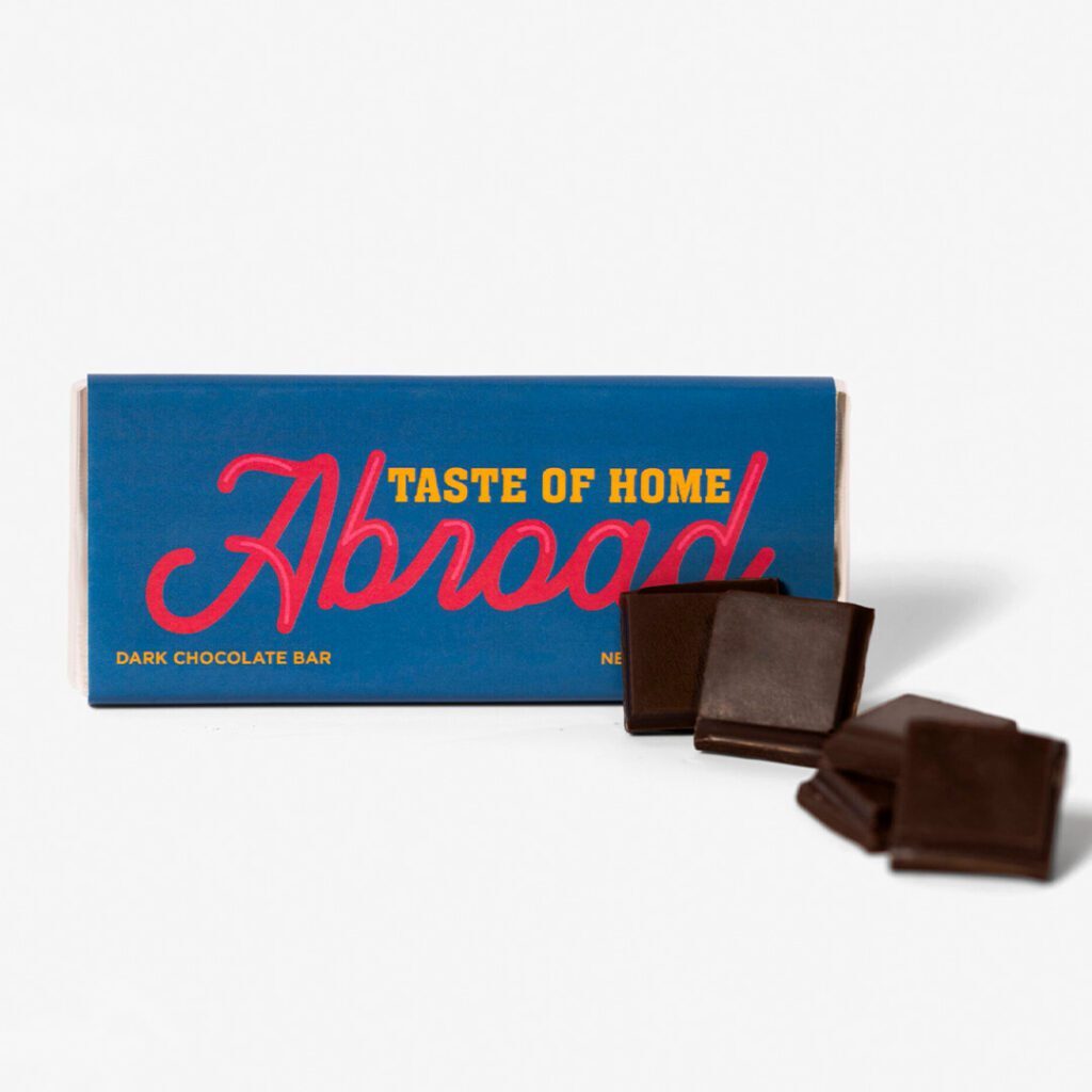 A box of chocolate with the words " abroad " on it.